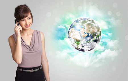 Young business woman with earth and cloud concept, Elements of this image furnished by NASA
