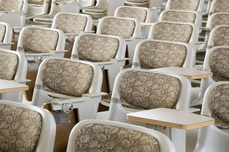 Padded backs of seats in college lecture hall