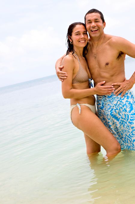 happy couple at the beach during vacation