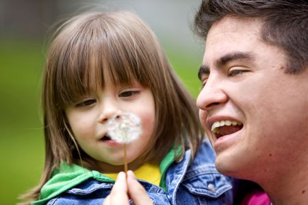 family lifestyle portrait of a dad with his son having fun outdoors