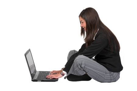 girl on a laptop on the floor over white