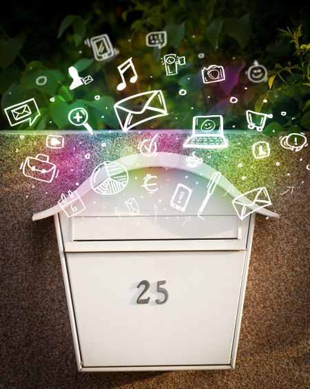 Colorful modern icons and symbols bursting out of a mailbox