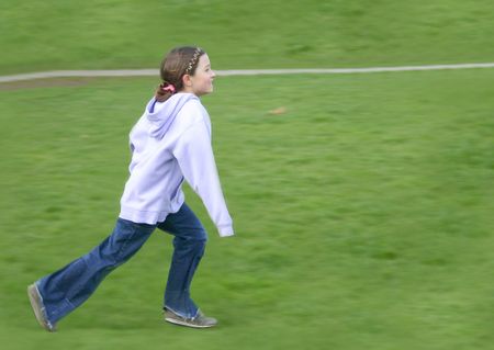 Child running in a park