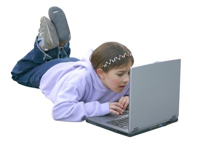 beautiful little girl using a laptop at the playground