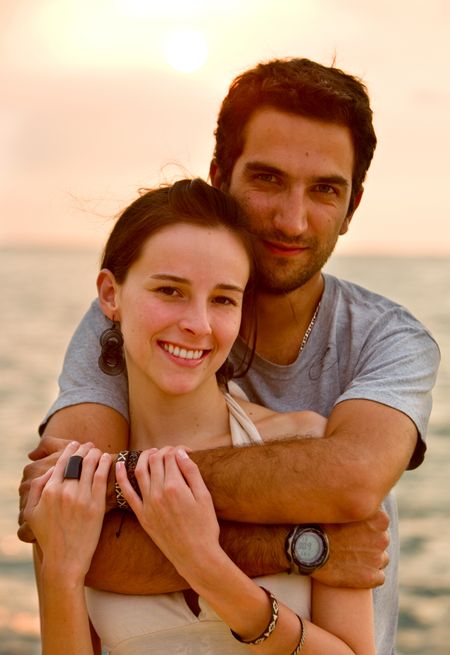 happy couple portrait at sunset in a romantic setting