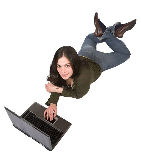 beautiful girl using a laptop on the floor over a white background