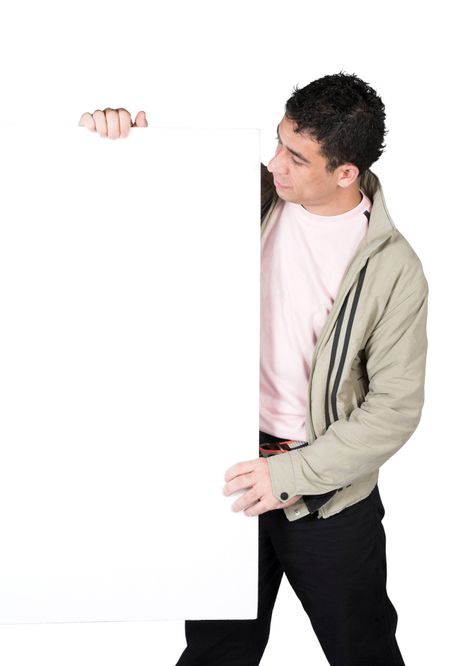 casual guy holding a white board over a white background - clipping path included