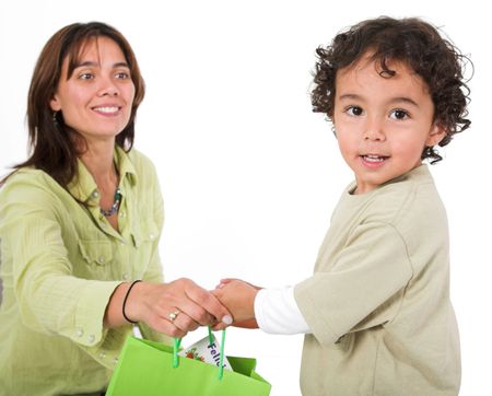 happy kid receiving a gift from his mum