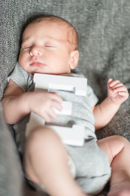 Cute newborn baby serie on grey