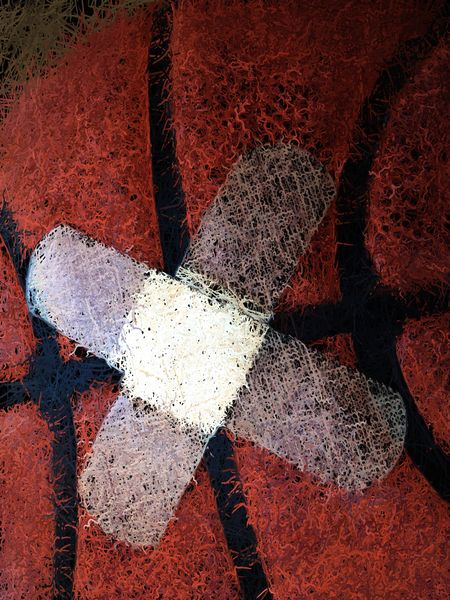 Closeup of two bandages on basketball (stylized version of indoor photo)