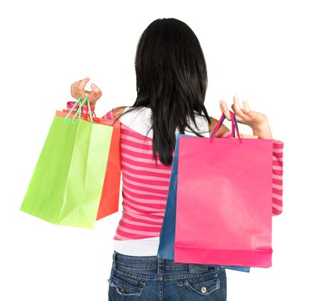 girl in pink holding bags over white