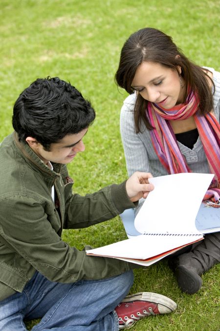 college or university students studying outdoors