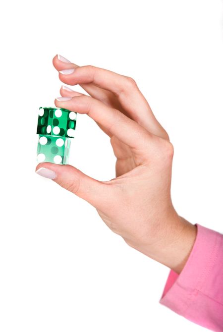 hand holding dices over white