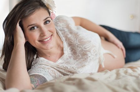Natural light portrait of a pregnant young woman