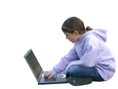 beautiful little girl using a laptop at the playground