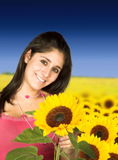 beautiful girl in sunflower field outdoors