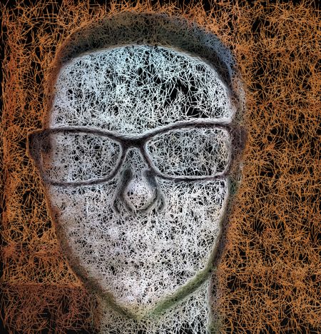 Abstract of plastic head of nerd with horn-rimmed eyeglasses