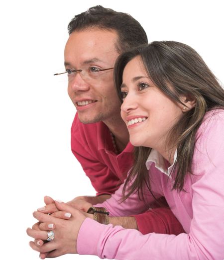 casual couple in love over white on the floor looking away