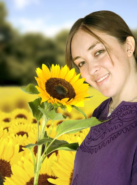 beautiful girl in sunflower field on a sunny day