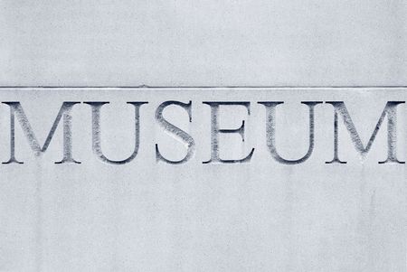 The word "museum" engraved in capital letters in exterior wall