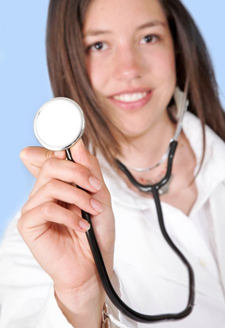 friendly female doctor with stethoscope over blue background
