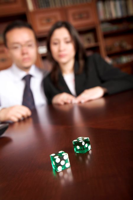 business gamblers in their office - shallow depth of field with focus on dices