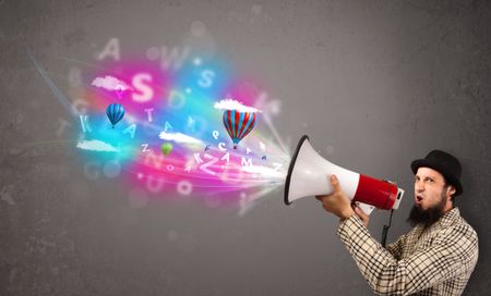 Handsome man shouting into megaphone and abstract text and balloons come out