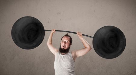 Funny skinny guy lifting incredible weights