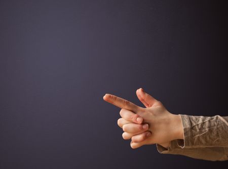 Gun shaped woman hand with empty space