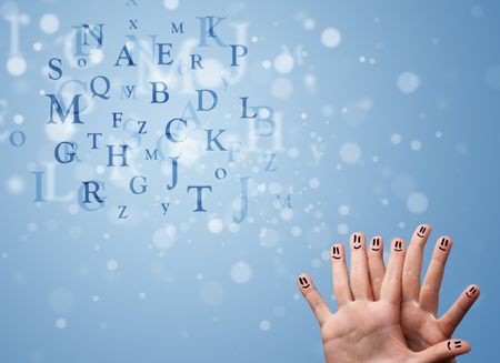 Happy cheerful smiley fingers looking at mixture of bokeh letters