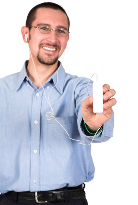 casual guy listening to mp3 music over white - focus on mp3 player