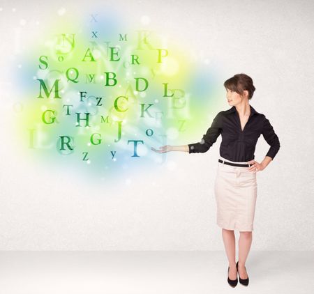 Business women with green glowing letter concept