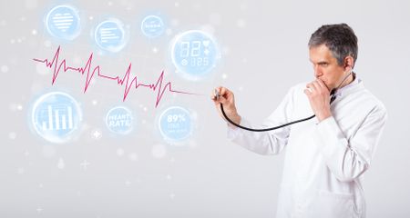 Clinical doctor examinating modern heartbeat graphics
