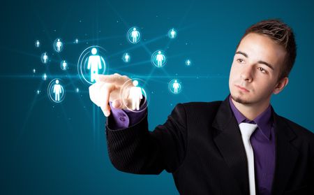 Businessman pressing modern social buttons on a virtual background