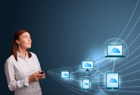 pretty-young-lady-typing-smartphone-cloud-194771141 Pretty young lady typing on smartphone with cloud computing
