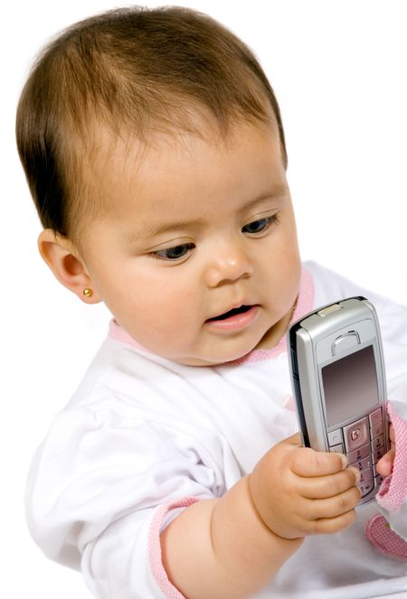baby girl with a mobile phone over white