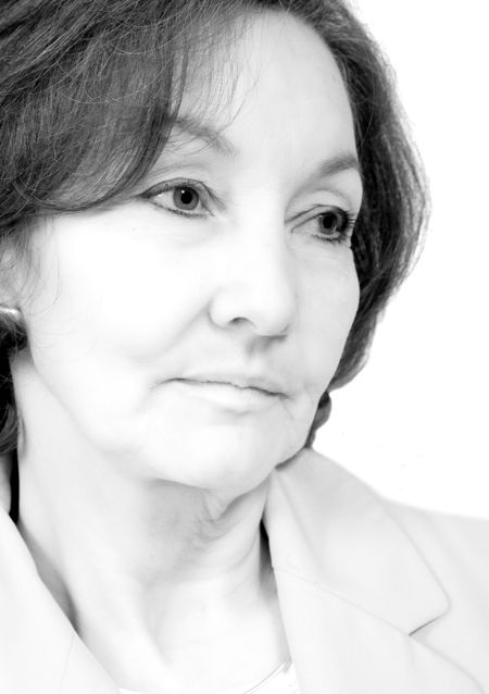 business senior portrait over white in a pensive expression - black and white