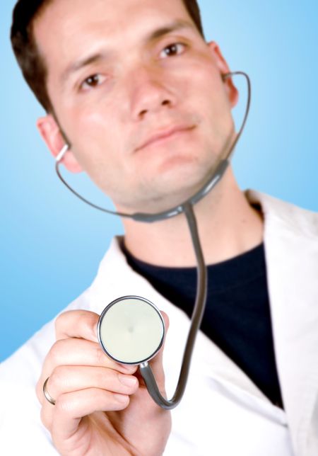 male doctor over blue background with a stethoscope