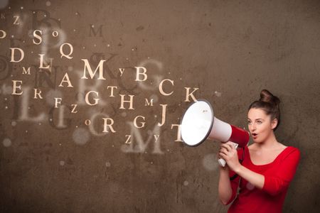 Young girl shouting into megaphone and abstract text come out