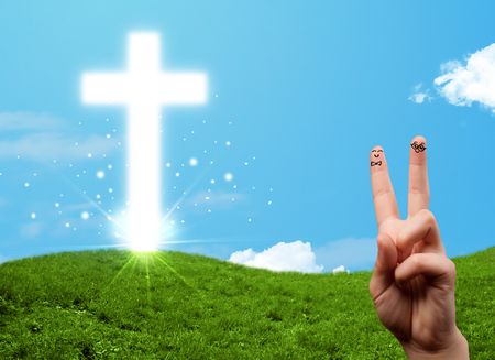 Happy finger smiley faces on hand with christian religion cross