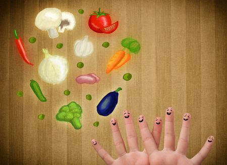 Happy smiley face fingers cheerfully looking at illustration of colorful healthy vegetables