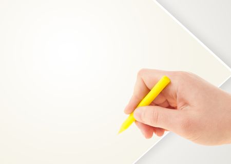 Child drawing with colorful crayon on empty plain blank paper 