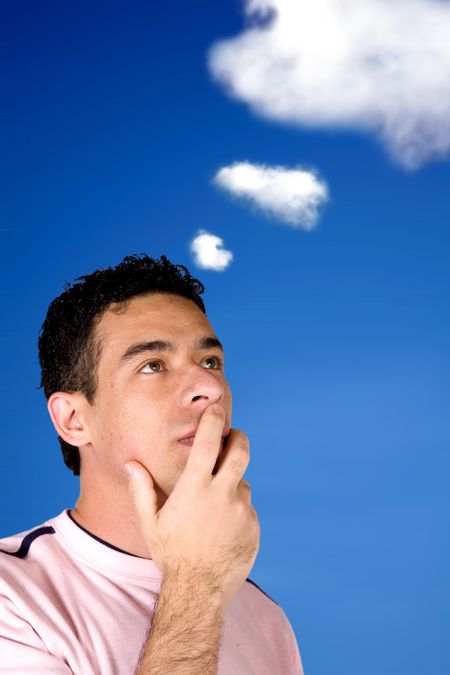 casual pensive man with the sky and clouds in the background