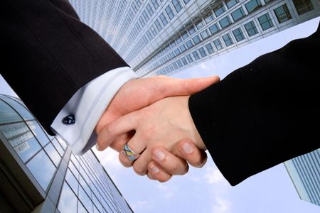 business deal - male and female in a corporate environment