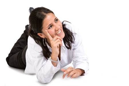 business woman full of expectations over a white background lying on the floor