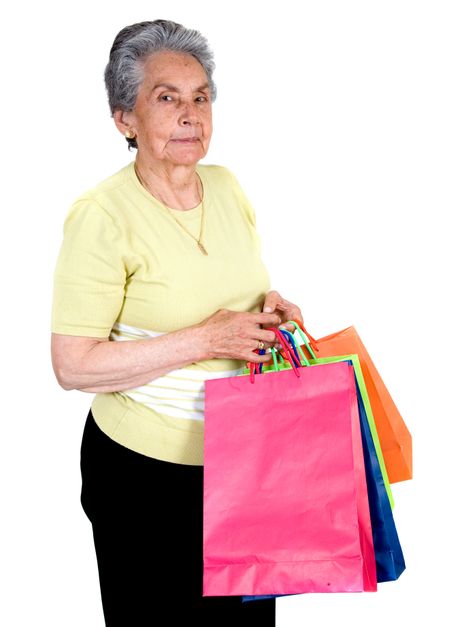 elderly woman shopping over a white background
