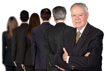 business people in a series with a senior boss standing facing the camera