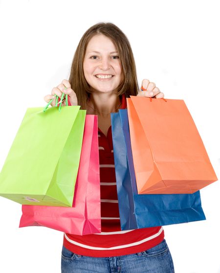 beautiful girl with shopping bags over white