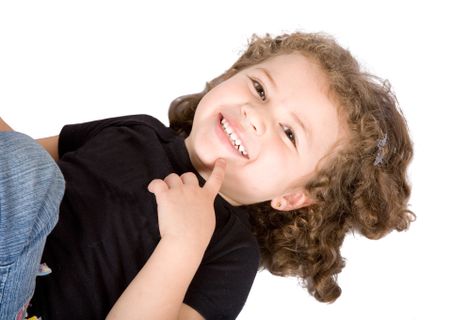 little girl smiling over a white background