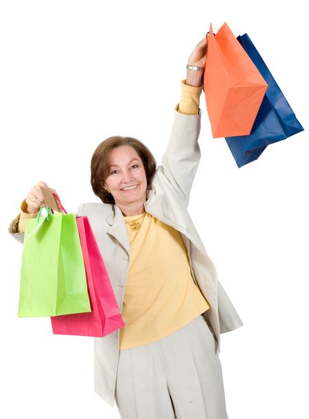 business woman very happy with her shopping bags over a white background